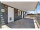 Covered back patio featuring gray siding and white trim at 21 Laswell St, Henderson, NV 89015