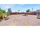 Back yard featuring mature palm trees and dirt and gravel landscaping at 21 Laswell St, Henderson, NV 89015