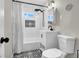 Charming bathroom features decorative tile and shower with white subway tile at 21 Laswell St, Henderson, NV 89015