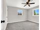 Empty bedroom with carpet, ceiling fan and natural light at 21 Laswell St, Henderson, NV 89015