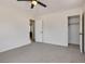 Neutral bedroom featuring gray carpet, ceiling fan, and white trim at 21 Laswell St, Henderson, NV 89015
