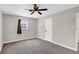 Bedroom features ceiling fan, neutral walls, carpet and natural light at 21 Laswell St, Henderson, NV 89015