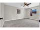 Empty bedroom with ceiling fan, carpet, and natural light at 21 Laswell St, Henderson, NV 89015