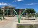 Henderson City Hall boasts modern architecture, lush landscaping, and inviting public art against a backdrop of clear blue skies at 21 Laswell St, Henderson, NV 89015