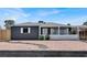 Charming single-story home featuring a gray exterior, white trim, and low-maintenance landscaping at 21 Laswell St, Henderson, NV 89015