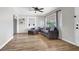 Comfortable living room with modern furnishings, laminate floors, and bright natural light at 21 Laswell St, Henderson, NV 89015
