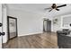 Open-concept living room featuring sleek laminate flooring and plenty of natural light at 21 Laswell St, Henderson, NV 89015