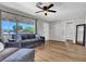 Inviting living room featuring a ceiling fan and natural light at 21 Laswell St, Henderson, NV 89015