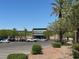 Neighborhood shopping center with a variety of businesses and mature trees at 21 Laswell St, Henderson, NV 89015