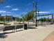 Street view of Henderson City Hall includes benches, trees, and a Water Street District sign against a bright, sunny skyline at 21 Laswell St, Henderson, NV 89015