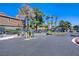 Gated community entrance with security features and lush landscaping at 220 Mission Newport Ln # 105, Las Vegas, NV 89107