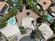 Overhead shot of homes with pools and solar panels, set in a neighborhood with desert landscaping at 2500 Cortina Ave, Henderson, NV 89074