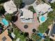 Bird's-eye view of properties with pools and desert landscaping, offering a comprehensive look at the community at 2500 Cortina Ave, Henderson, NV 89074