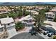 Aerial view of a neighborhood, highlighting homes with pools and desert landscaping, showcasing community living at 2500 Cortina Ave, Henderson, NV 89074