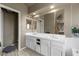 Bathroom with dual vanity, tile countertops, and ample cabinet space at 2500 Cortina Ave, Henderson, NV 89074