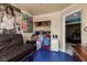 Bedroom featuring painted floor, futon, and doorway to other rooms at 2500 Cortina Ave, Henderson, NV 89074