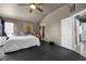 Neutral bedroom with large bed, soft light, and black floor at 2500 Cortina Ave, Henderson, NV 89074