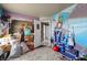 Eclectic bedroom features colorful painted walls, whimsical decor, and ample storage at 2500 Cortina Ave, Henderson, NV 89074
