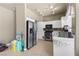 Bright kitchen featuring stainless steel appliances and white cabinets, blending style with functionality at 2500 Cortina Ave, Henderson, NV 89074