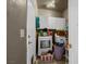 Functional laundry room featuring a white washer and dryer, complemented by overhead cabinets for storage at 2500 Cortina Ave, Henderson, NV 89074