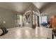 Bright living room with large windows, offering natural light, paired with tile flooring and neutral walls at 2500 Cortina Ave, Henderson, NV 89074