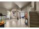 Bright living room with neutral walls, tiled floors, and large windows providing natural light at 2500 Cortina Ave, Henderson, NV 89074