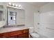 Clean bathroom with tub, shower, and wood vanity with a stone countertop at 2801 N Rainbow Blvd # 273, Las Vegas, NV 89108