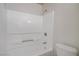 Bathroom features a white shower and tub combo with white tile surround at 2801 N Rainbow Blvd # 273, Las Vegas, NV 89108