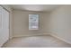 Minimalist bedroom with carpet flooring, a closet, and a bright window at 2801 N Rainbow Blvd # 273, Las Vegas, NV 89108