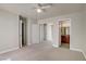 Comfortable bedroom features plush carpet, ceiling fan, and an en suite bathroom at 2801 N Rainbow Blvd # 273, Las Vegas, NV 89108