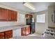 Bright kitchen featuring dark cabinets, granite countertops, and stainless steel appliances at 2801 N Rainbow Blvd # 273, Las Vegas, NV 89108