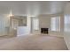 Bright living room with a fireplace, carpeted floors, and abundant natural light from large windows at 2801 N Rainbow Blvd # 273, Las Vegas, NV 89108