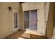 Outdoor patio with wooden floor and sliding glass doors to enter the home at 2801 N Rainbow Blvd # 273, Las Vegas, NV 89108