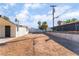 A side view of the backyard showing a block wall and chain link fence at 2878 El Cajon St, Las Vegas, NV 89169