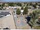Aerial view of a home in a desert landscape, surrounded by mature trees and desert landscaping at 3031 Pebble Beach Ave, Pahrump, NV 89048
