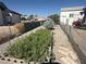 A look down the side of a lot at 3031 Pebble Beach Ave, Pahrump, NV 89048