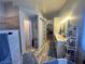 Spacious bathroom featuring a double sink vanity, soaking tub, and access to the bedroom and toilet at 3031 Pebble Beach Ave, Pahrump, NV 89048