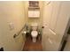Small bathroom features a toilet, storage cabinet and towel bar, tiled floor, and fresh paint at 3031 Pebble Beach Ave, Pahrump, NV 89048