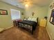 Bedroom with carpet, ceiling fan, bed, and dresser with yellow drawers at 3031 Pebble Beach Ave, Pahrump, NV 89048
