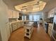 Bright kitchen features stylish lighting, stainless appliances, and ample counter space for cooking at 3031 Pebble Beach Ave, Pahrump, NV 89048