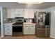 Well-lit kitchen with stainless steel appliances, ample counter space, and modern backsplash design at 3031 Pebble Beach Ave, Pahrump, NV 89048