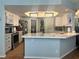 Well-equipped kitchen featuring stainless appliances, modern finishes, and a convenient breakfast bar at 3031 Pebble Beach Ave, Pahrump, NV 89048