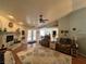 Inviting living room with a brick fireplace, hardwood floors, and ample natural light at 3031 Pebble Beach Ave, Pahrump, NV 89048