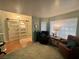 Inviting living room featuring a modern sliding barn door and comfortable seating area at 3031 Pebble Beach Ave, Pahrump, NV 89048