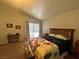 The main bedroom features an exterior door, and a patchwork quilt at 3031 Pebble Beach Ave, Pahrump, NV 89048