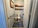 Toilet room features a standard toilet, storage shelves, and a grab bar for accessibility at 3031 Pebble Beach Ave, Pahrump, NV 89048