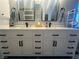 Bright bathroom featuring double vanity with white countertop, black faucets, and modern black hardware at 3031 Pebble Beach Ave, Pahrump, NV 89048