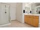 Bright bathroom featuring a glass-enclosed shower, a door, and modern vanity at 3088 Evening Mist Ave, Henderson, NV 89052