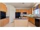 Kitchen featuring granite countertops, oak cabinets, stainless steel appliances, and a center island at 3088 Evening Mist Ave, Henderson, NV 89052