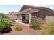 Cozy covered patio with outdoor seating and desert landscaping, perfect for relaxing or entertaining at 3088 Evening Mist Ave, Henderson, NV 89052